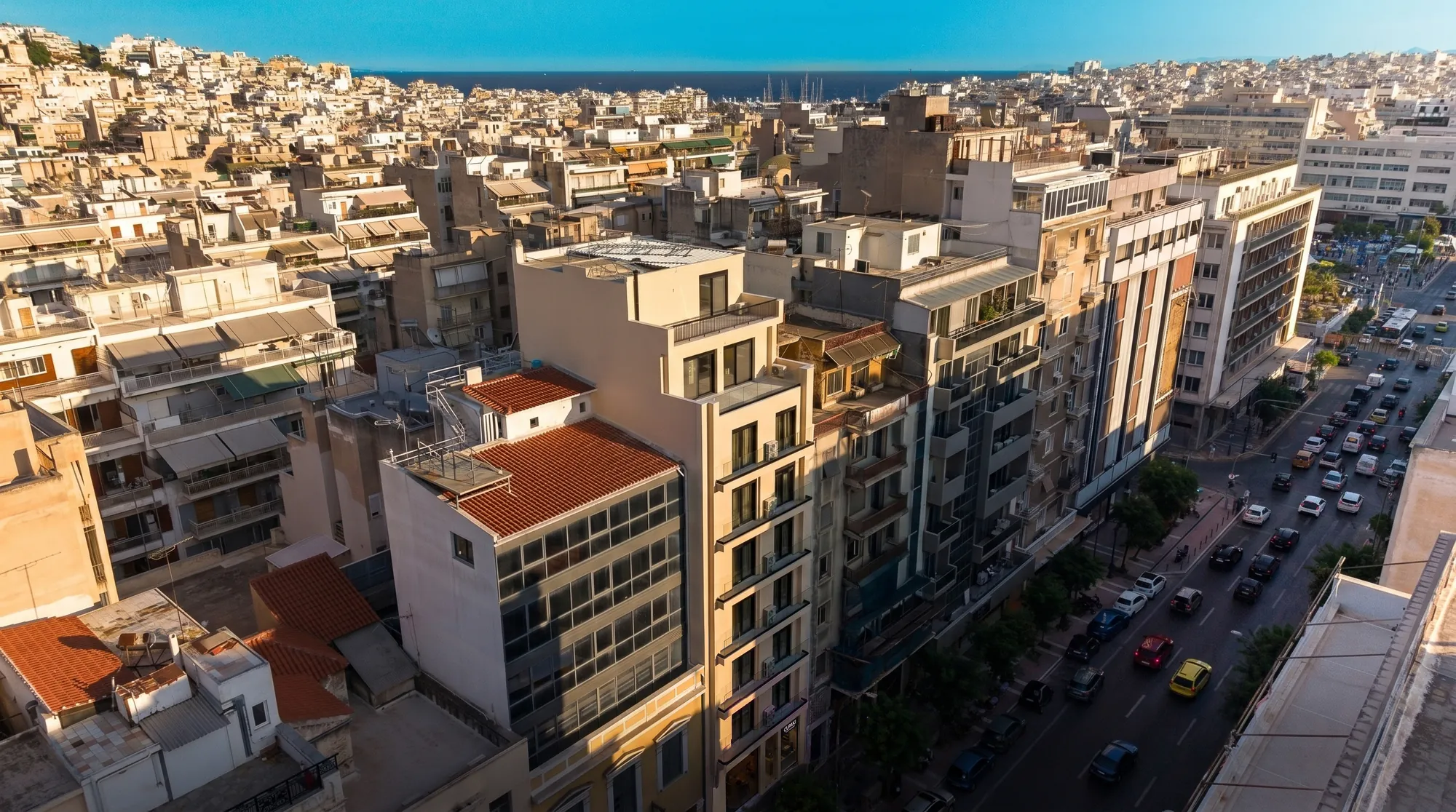 ORMOS Piraeus, the hotel building in its block on Iroon Polytechniou Avenue, from the air