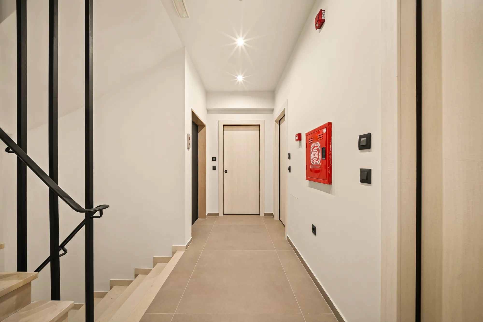ORMOS Piraeus, the landing and the corridor beyond the stair