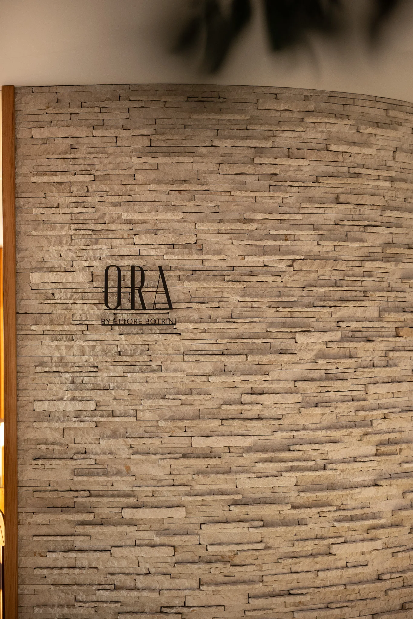 The Ora signage on the stone wall at One&Only Aesthesis