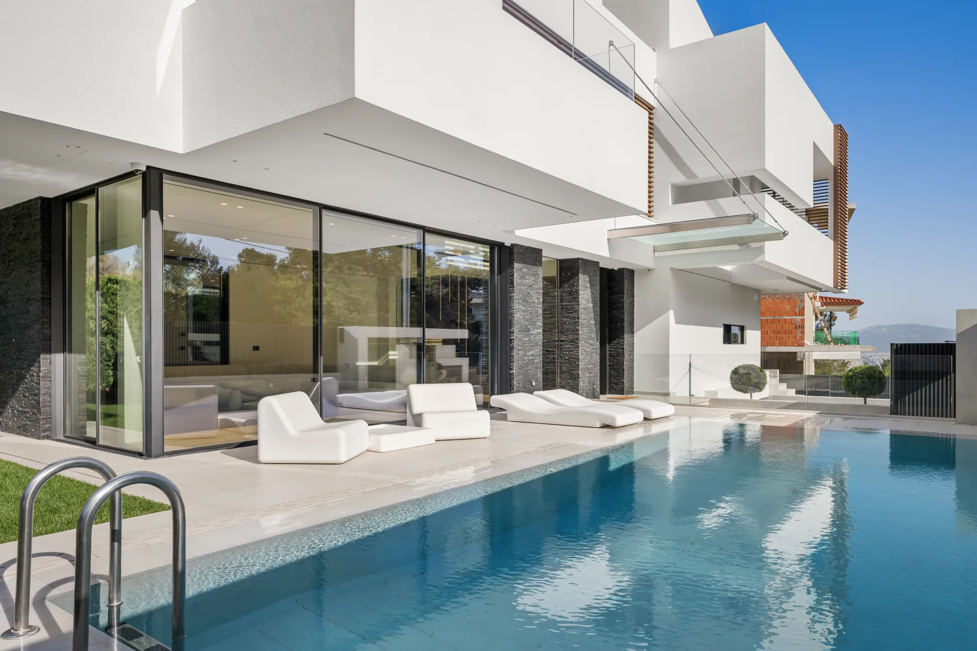 Villa Eden, a contemporary luxury villa in North Athens, with pool and full-height glazing